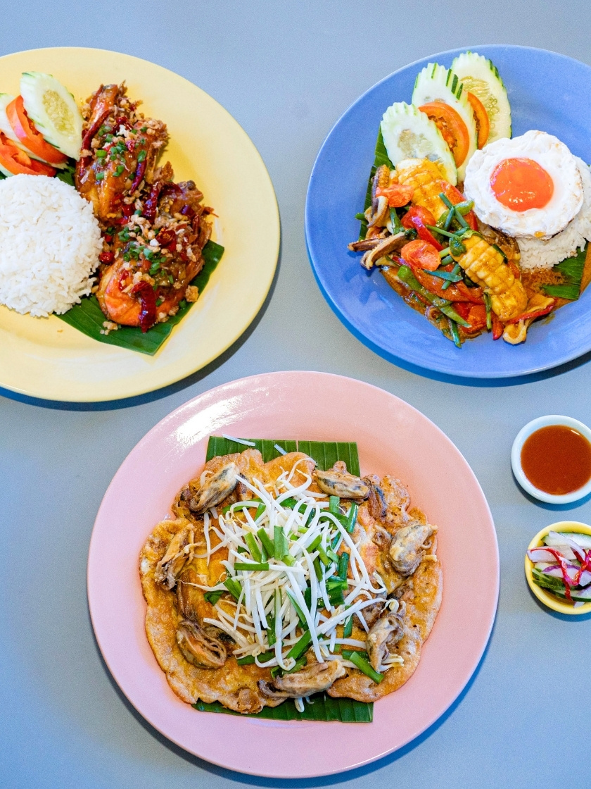 Savor Andaman-fresh seafood with bold local flavors—Pla Muek salted egg squid, crispy Hoy Thod and Goong Thod Kua Prik Glure, Phuket-style favorites.