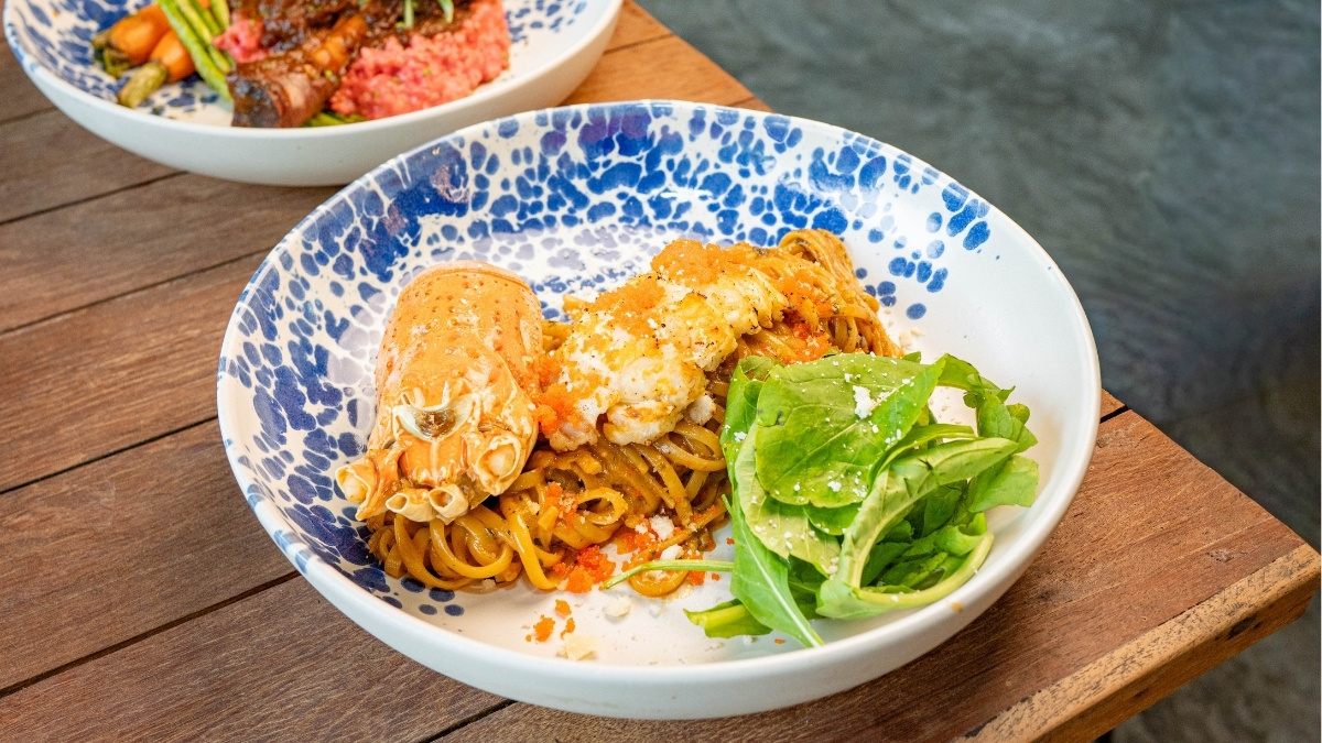 Indulge in tender lamb shank & Phuket lobster linguine — rich, comforting flavours made to share. Join us for a relaxed garden dining experience.